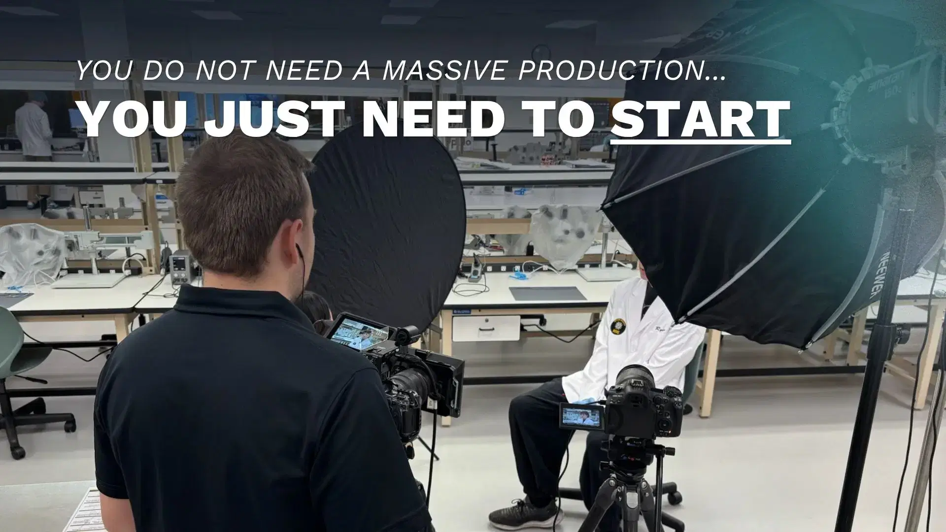 A Double Take Video camera operator filming a man for an interview with lights and audio equipment