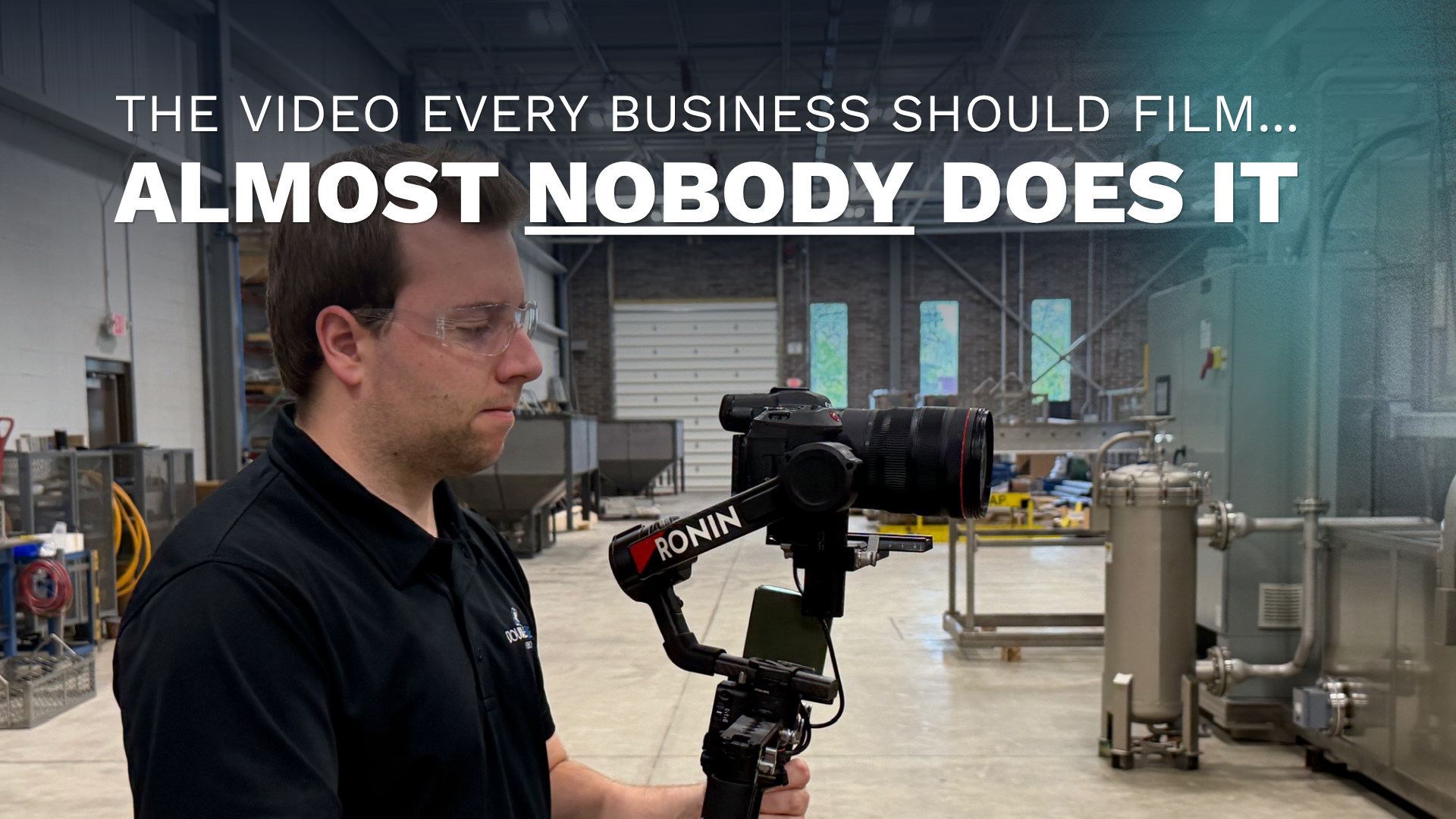 A Double Take Video camera operator filming a manufacturing machine