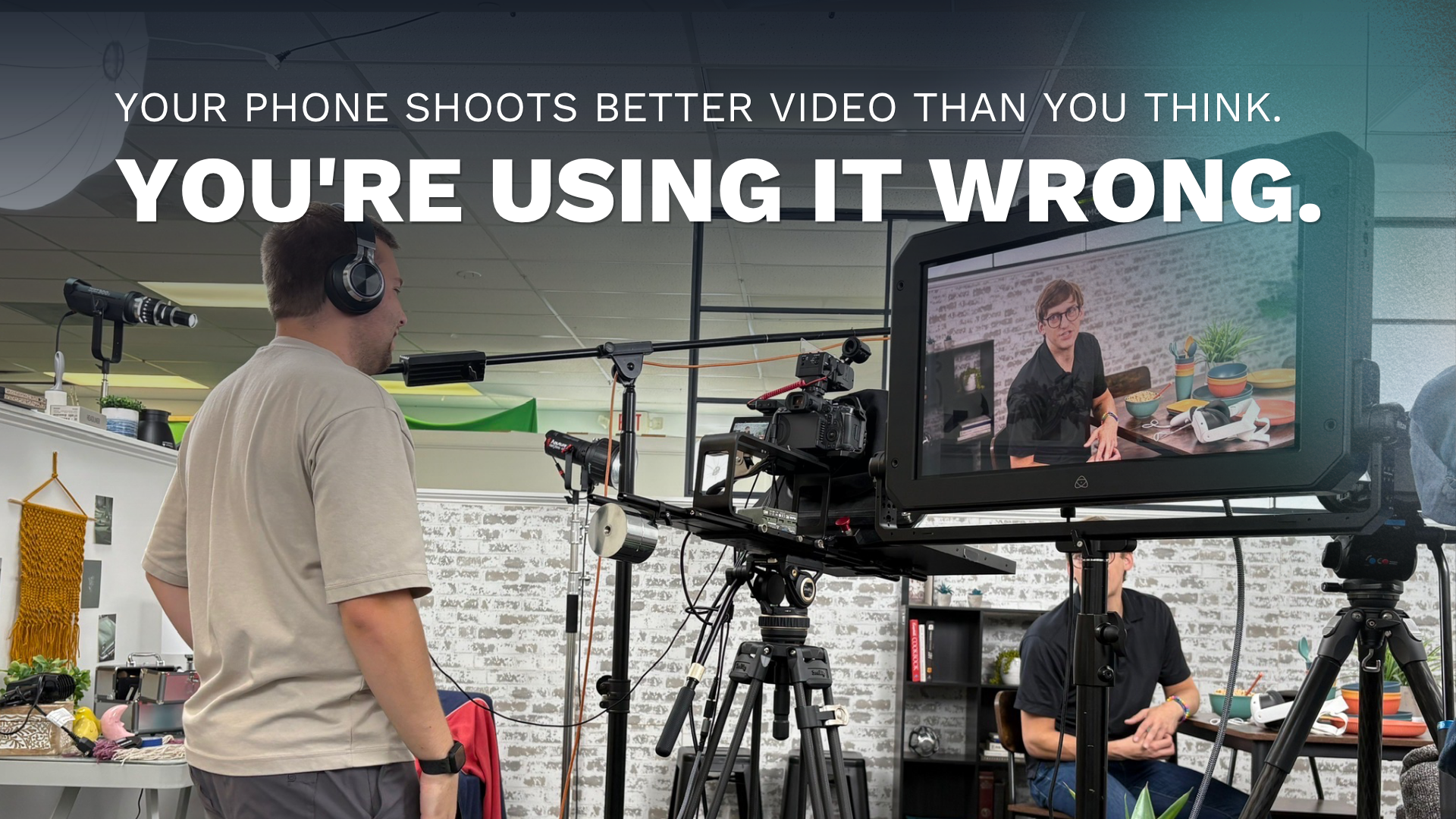 A Double Take Video camera operator filming a man speaking to camera